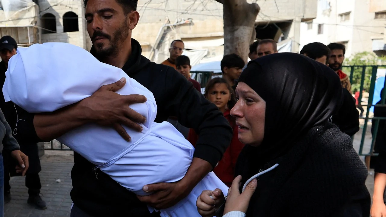 Palestinians bury pregnant woman and 2 of her children killed in Israeli attacks on Gaza
